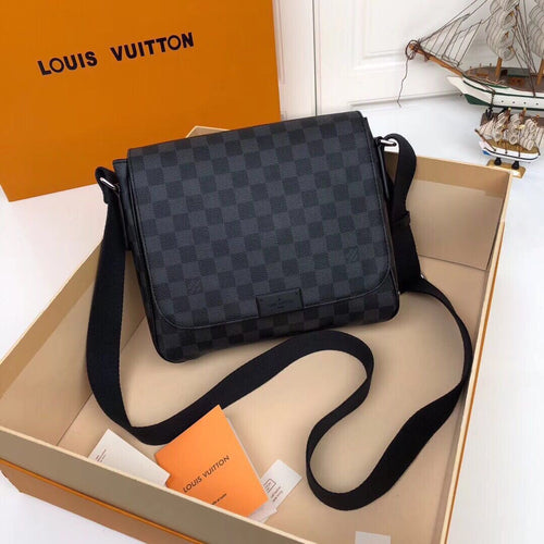 Black and grey checkerboard messenger bag with flap-front design and wide black shoulder strap