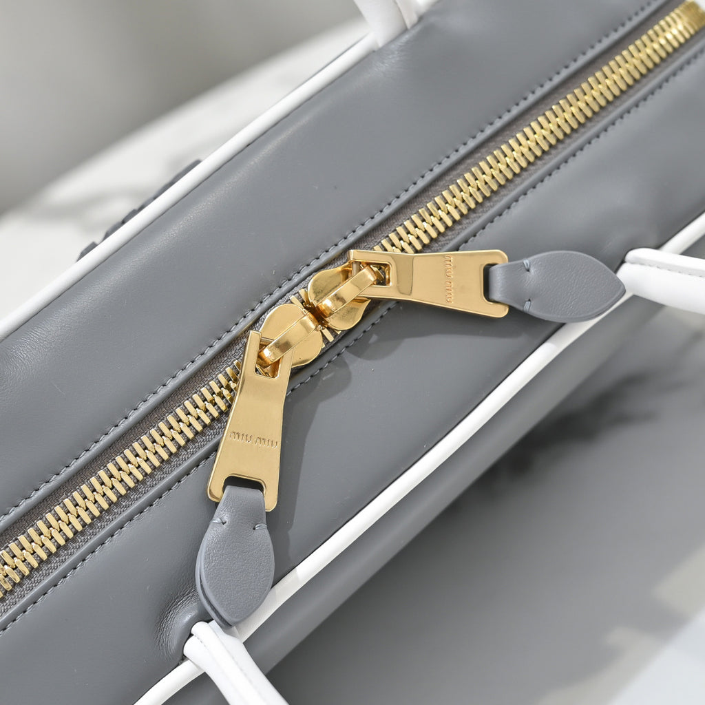 Grey Rectangular Bag with White Handles and Trim